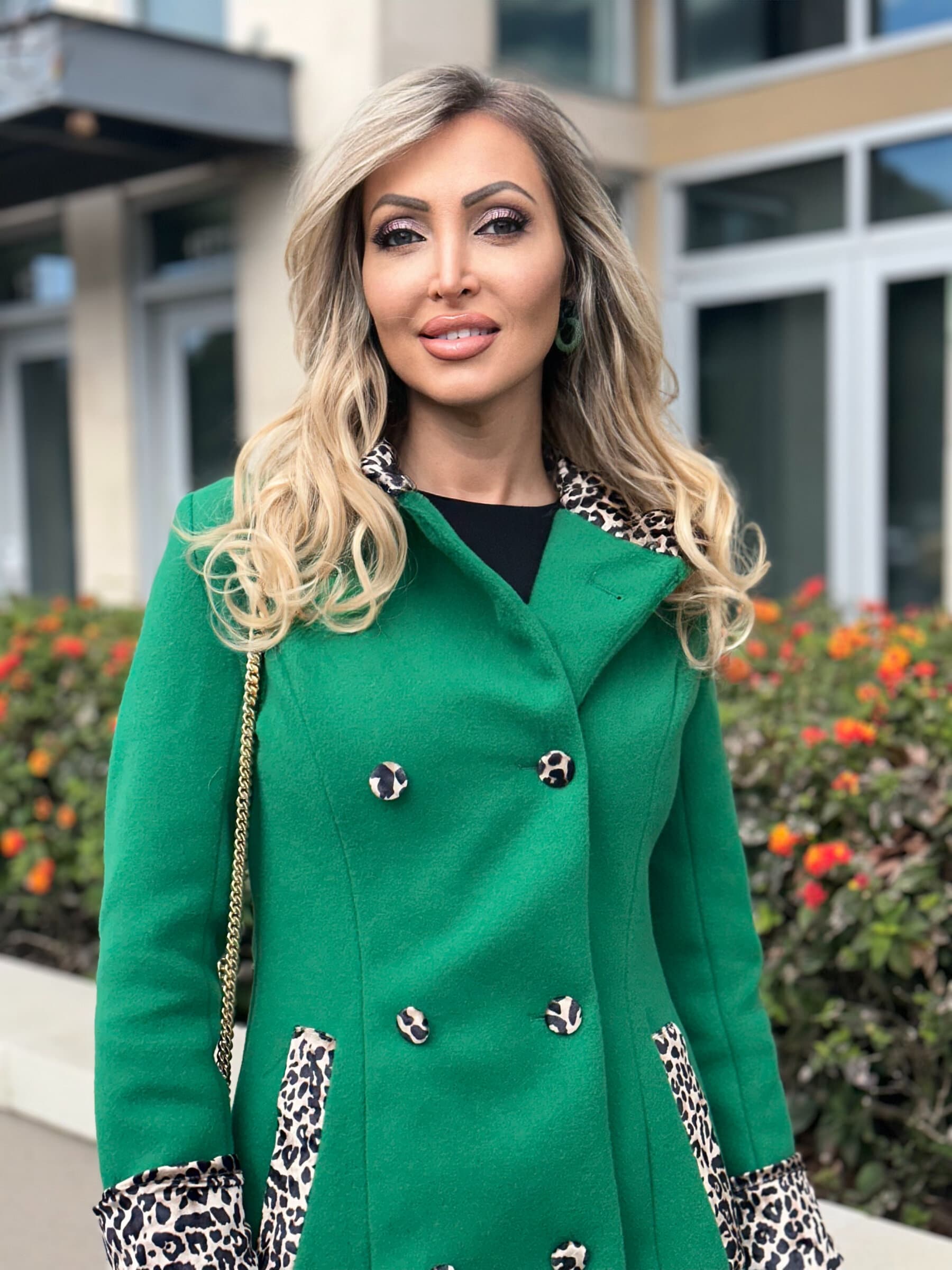 Veronika Mindal in an emerald coat with leopard trim
