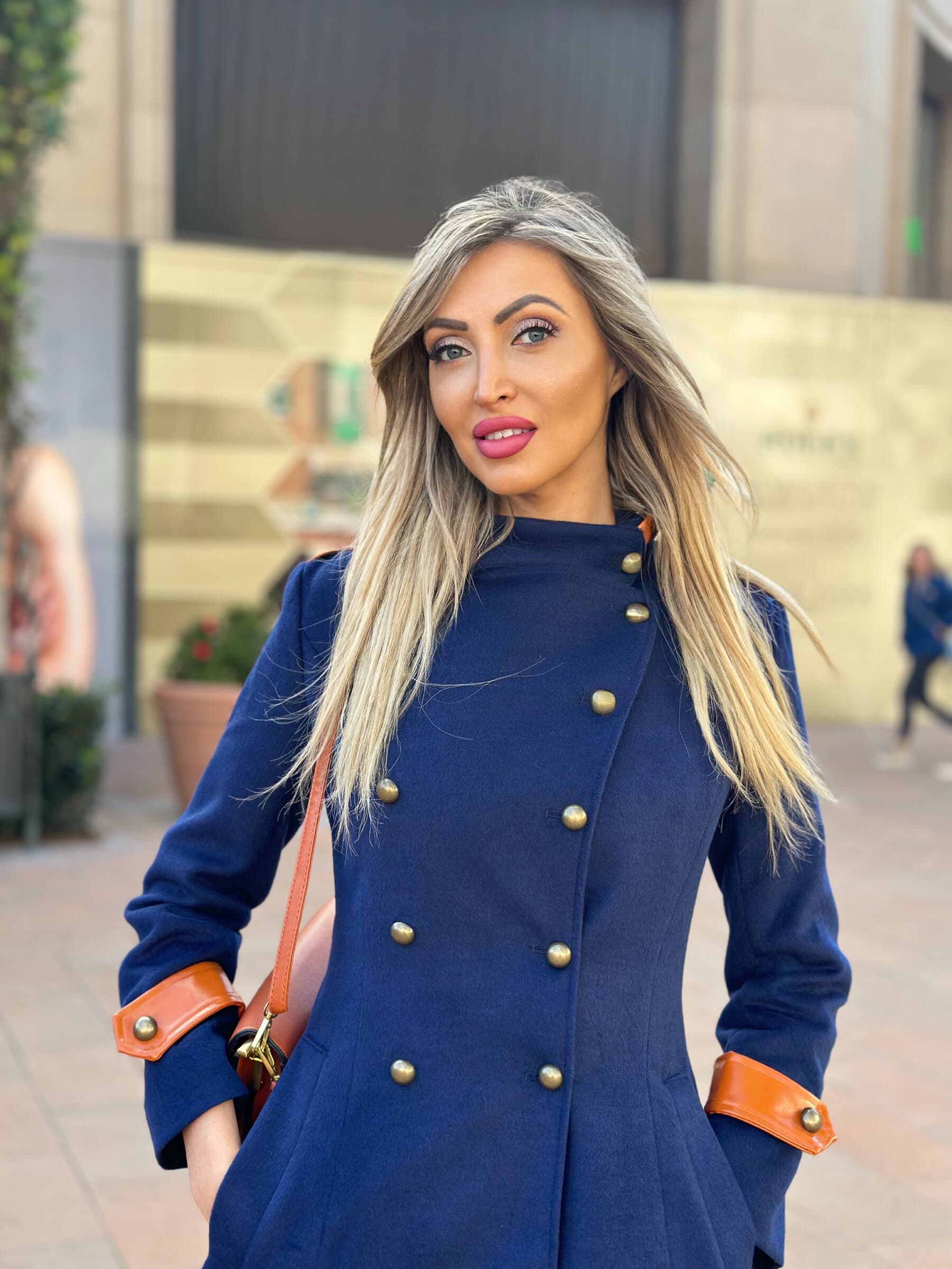 Veronika Mindal in a navy coat, portrait